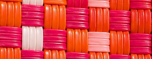 Close-up of the Peach Gala Bag woven pattern using 100% recycled plastic.