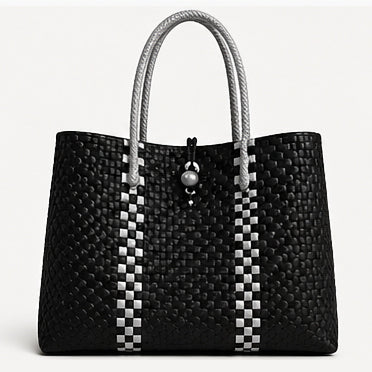Silver Fern Gala Bag – A bold black design accented with clean, contrasting lines, inspired by the strength and resilience of nature. Rooted, refined, and quietly powerful.